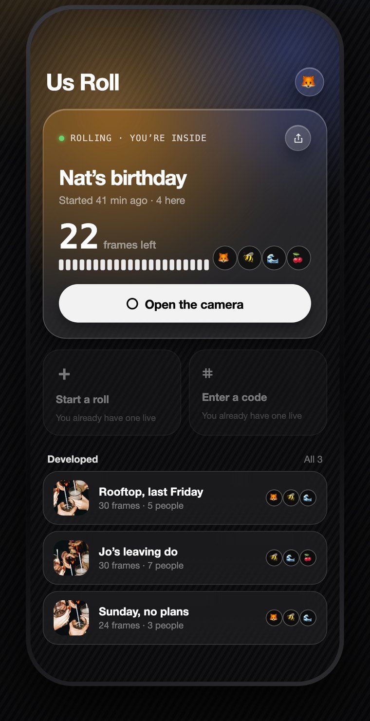The Us Roll home screen. A live roll called Nat's birthday shows 22 frames left, four people's emoji, and a button that opens the camera.